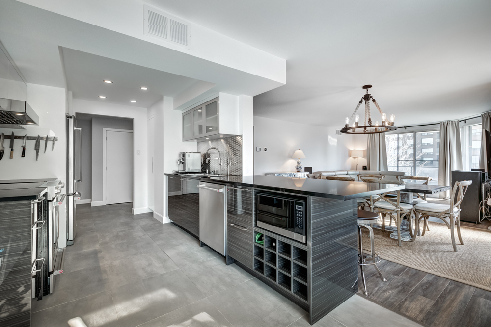 A kitchen with a wine rack and an island.